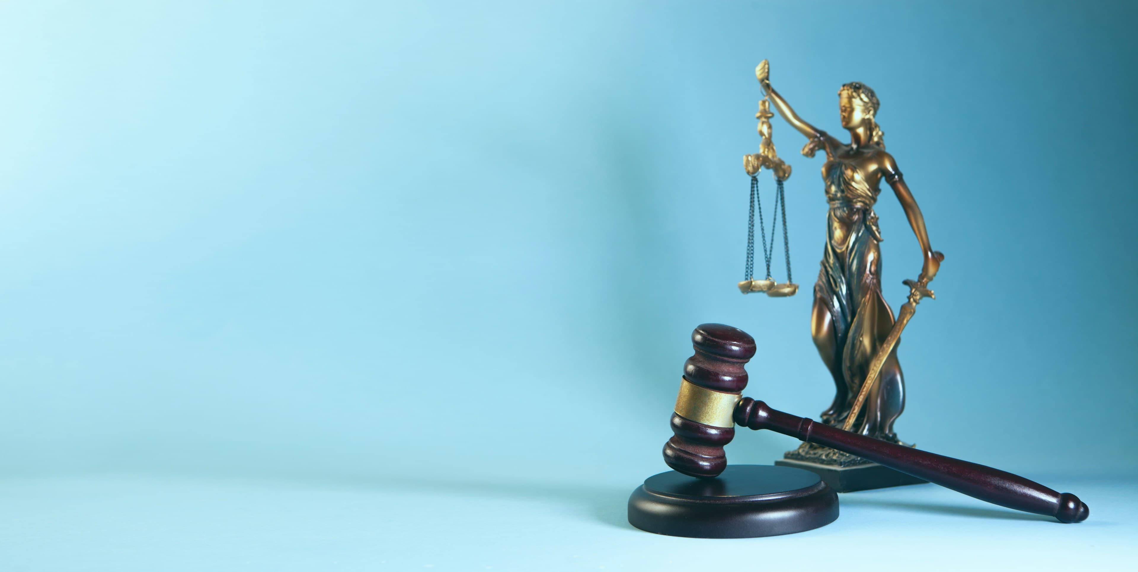 Scales of justice beside a gavel